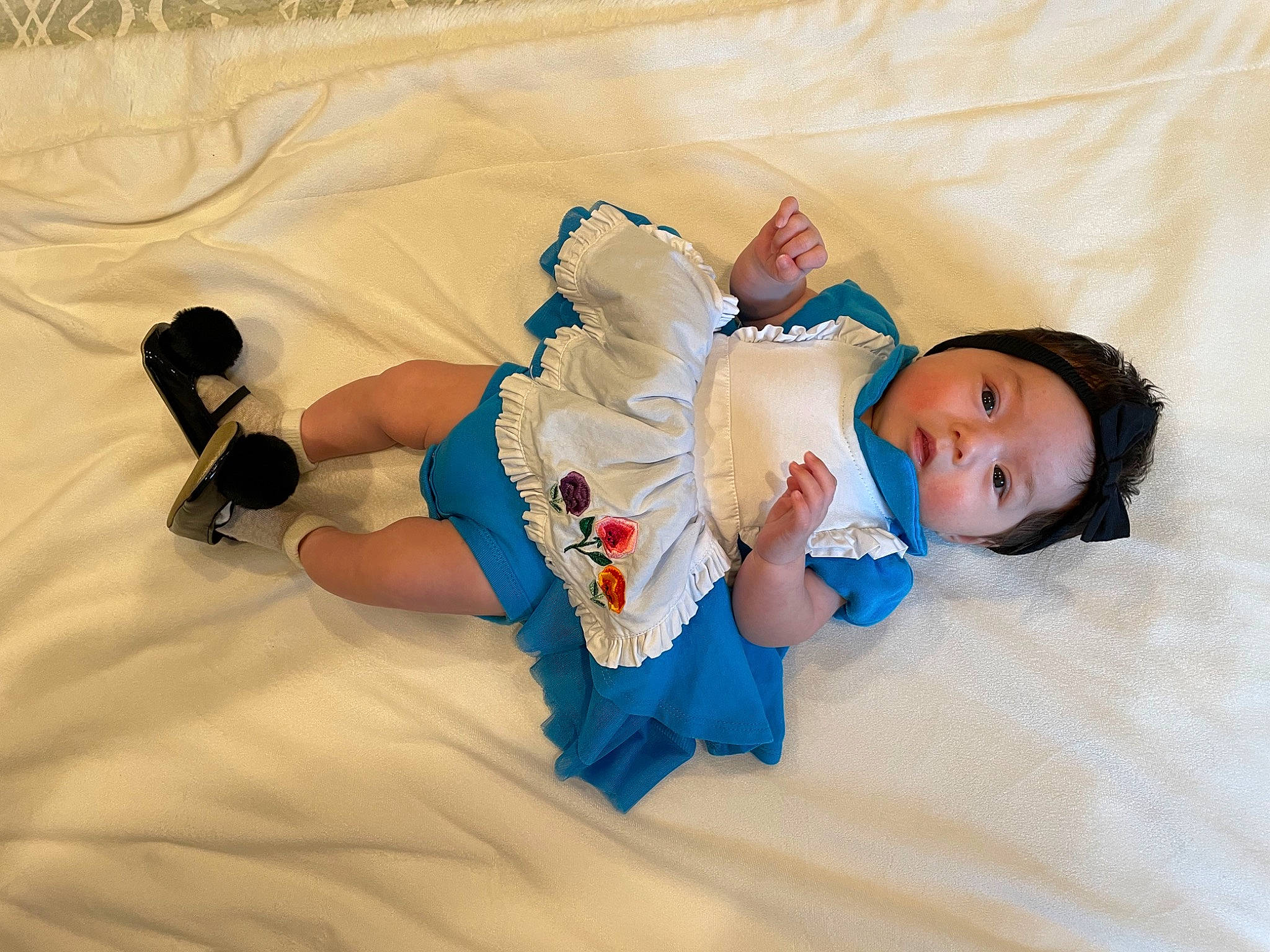 Claire joined the competition — help win amazing prizes! baby, baby_sleeping, baby_toddler_clothing, bedtime, child, comfort, electric_blue, finger, flooring, fun, happy, headwear, human_leg, knee, leisure, linens, person, room, sitting, sock