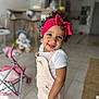 toddler, child, curly_hair, headband, pink_headband, overalls, white_shirt, barefoot, indoor, floor, tiles, toy_stroller, toys, smiling, happy, person, home, living_room, cute, playtime