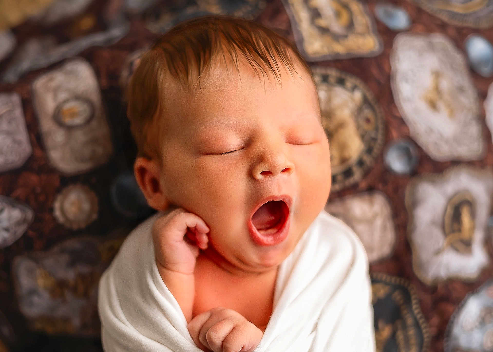 Melissa is registered to the contest to win money with this photo: baby, newborn, yawning, sleepy, wrapped, blanket, infant, cute, portrait, face, hand, closeup, soft, peaceful, child, indoors, human, skin, expression, resting