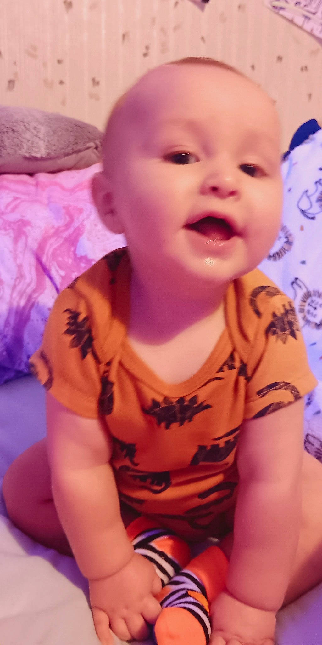 Clyde is registered to the contest to win money with this photo: baby, baby_toddler_clothing, cheek, chin, face, finger, happy, human_body, iris, lip, mouth, neck, nose, person, pink, skin, sleeve, smile, thumb, toddler