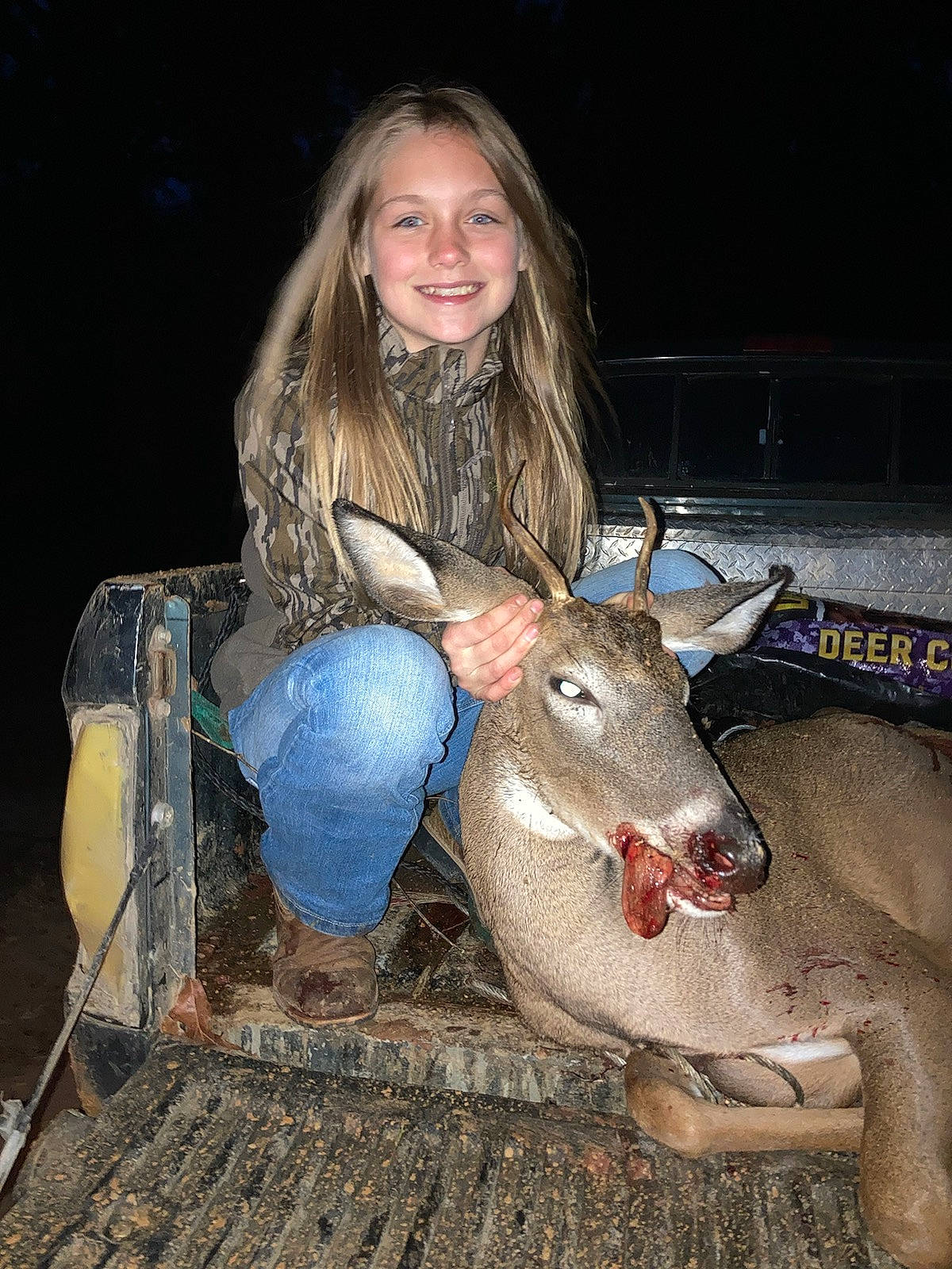 Brylee is registered to the contest to win money with this photo: eye, fawn, flash_photography, fun, fur, grass, happy, hay, head, human_leg, joy, landscape, livestock, night, person, portrait_photography, sitting, smile, soil, straw