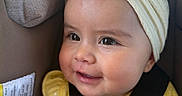 Layla is registered to the contest to win money with this photo: baby, child, car_seat, headband, yellow_clothing, smile, face, infant, seatbelt, cute, happy, safety, closeup, child_safety, portrait, adorable, infant_girl, baby_girl, seat, straps