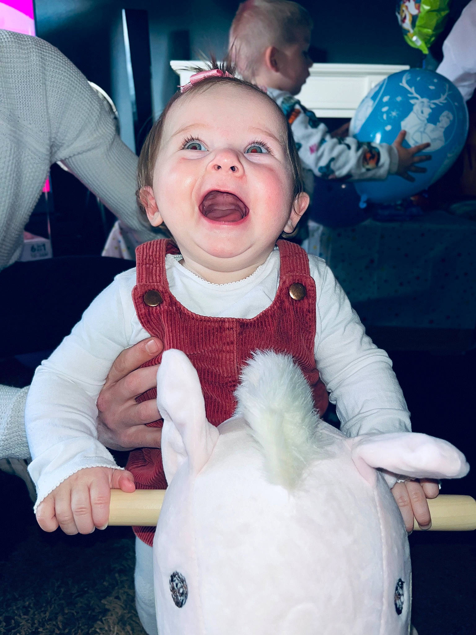 Olivia is registered to the contest to win money with this photo: baby, baby_toddler_clothing, blue, cheek, cool, finger, fun, gesture, happy, head, human_body, jacket, mammal, nose, organ, person, sleeve, textile, toddler, vertebrate