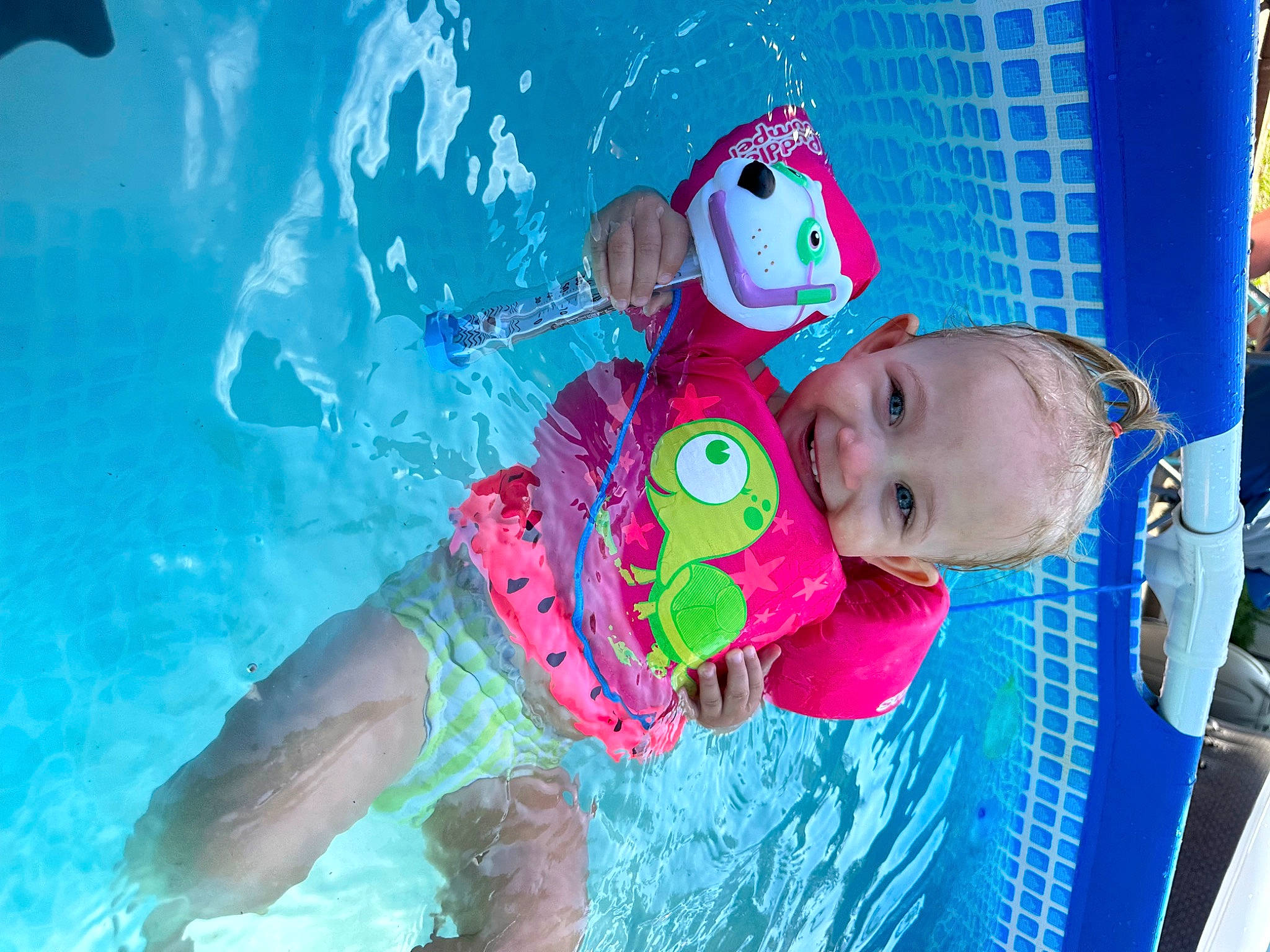 Lily Ann joined the competition — help win amazing prizes! azure, baby, baby_products, baby_toddler_clothing, child, event, fun, happy, headgear, joy, leisure, magenta, person, personal_protective_equipment, pink, play, recreation, swimmer, swimming_pool, toddler