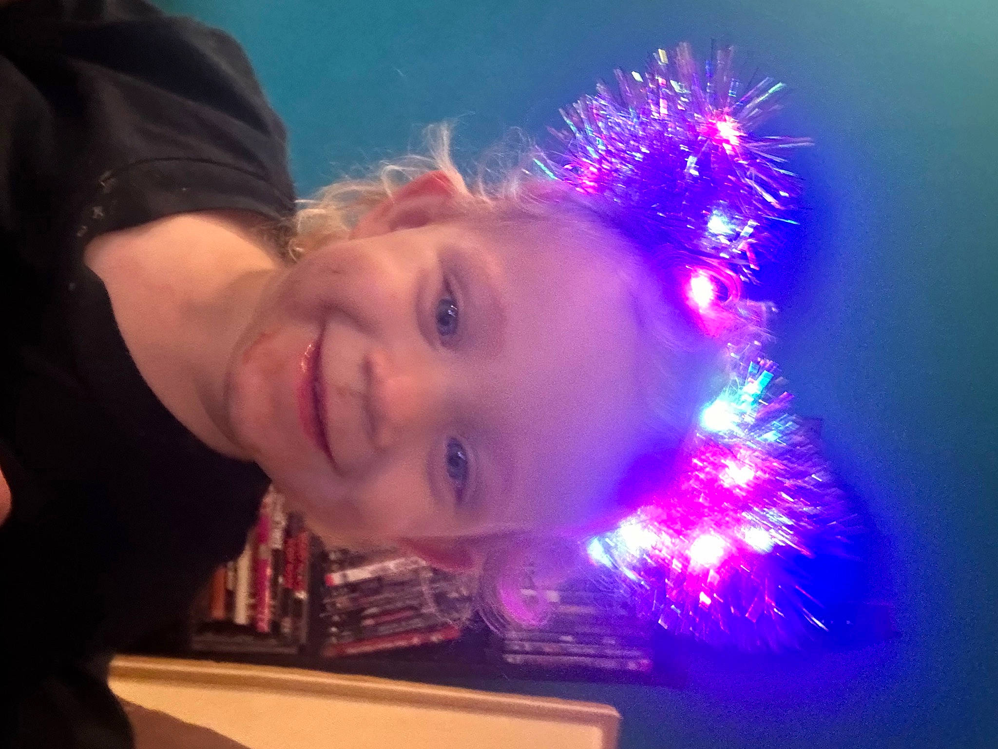 Lily Ann is registered to the contest to win money with this photo: christmas, christmas_decoration, christmas_lights, electric_blue, entertainment, event, flash_photography, fun, happy, holiday, interior_design, joy, lens_flare, midnight, new_year, night, person, purple, sky, smile