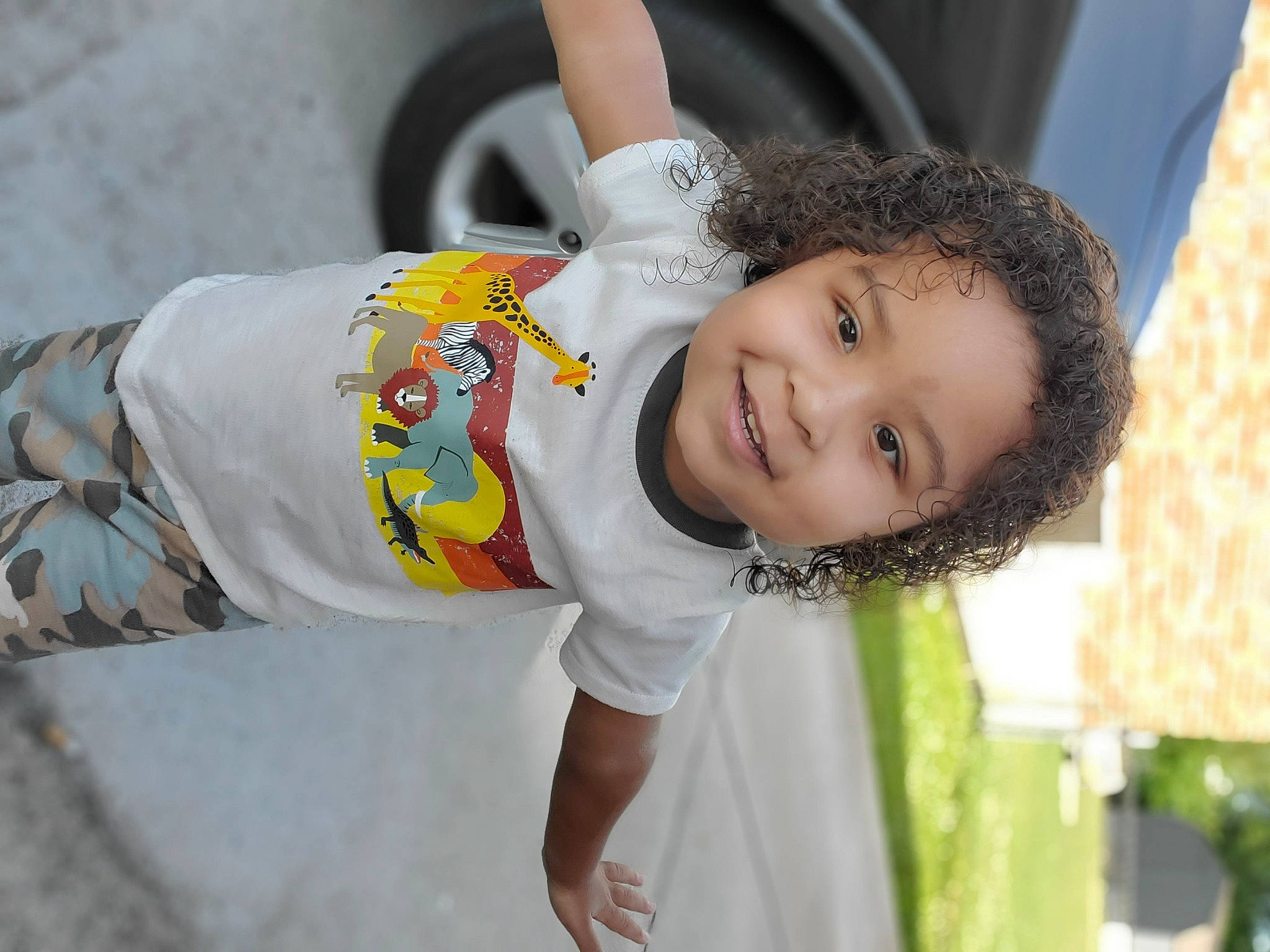 Dwaine is registered to the contest to win money with this photo: auto_part, baby, child, event, eye, fun, grass, hair, happy, joy, leisure, person, plant, play, recreation, skin, sleeve, smile, tire, toddler