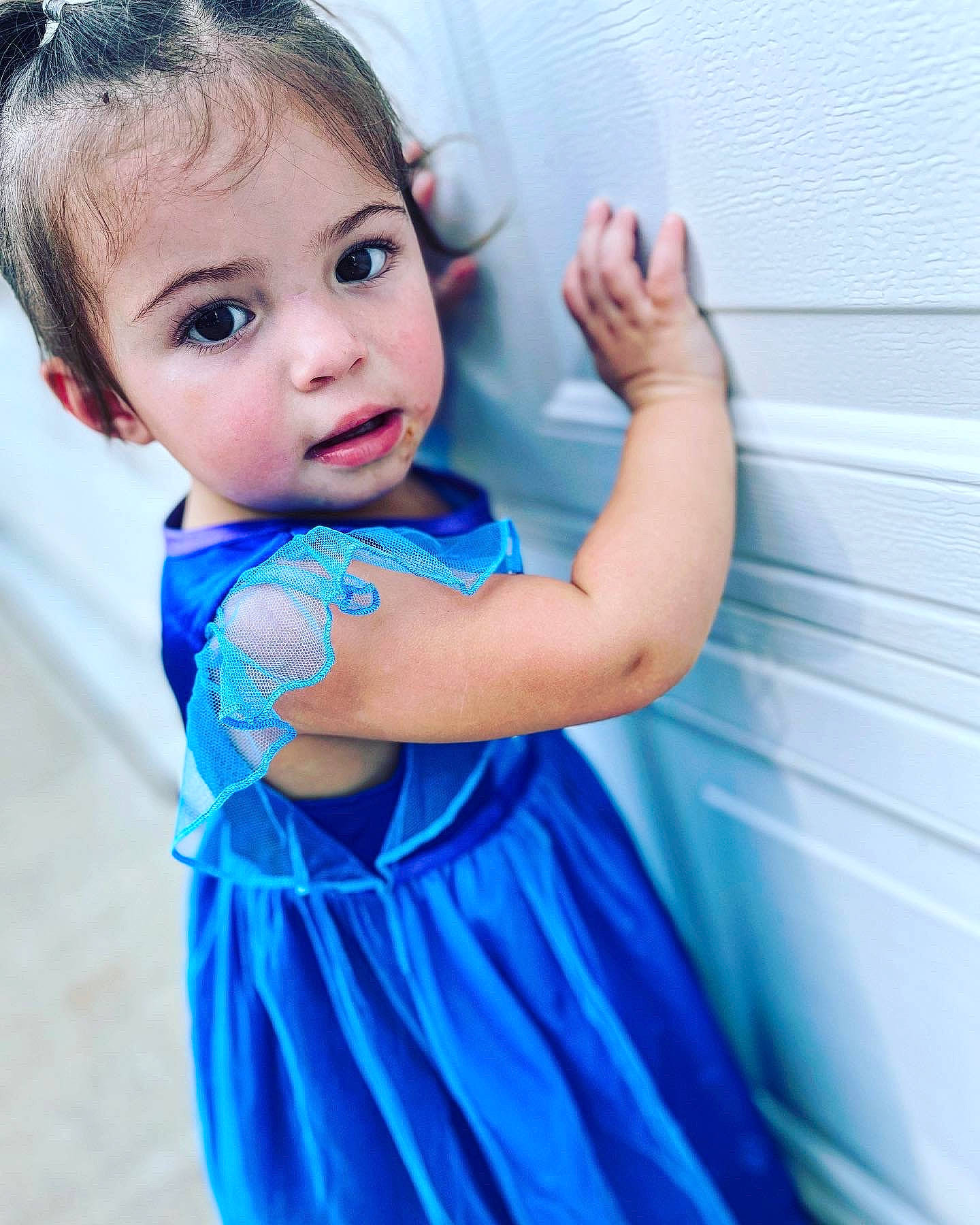 Arielle is registered to the contest to win money with this photo: arm, azure, baby_toddler_clothing, dress, eye, eyelash, face, finger, flash_photography, gesture, hair, hand, happy, human_body, iris, joint, neck, person, shoulder, sleeve