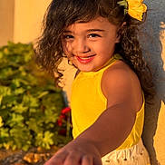 Pınar participe au concours pour gagner de l'argent avec cette photo : child, curly_hair, cute, face, flower, garden, girl, hand, happy, nature, outdoor, person, playful, portrait, skin, smiling, summer, sunlight, yellow_dress, youth