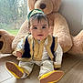 Noah participe au concours pour gagner de l'argent avec cette photo : baby, child, cute, daylight, floor, footwear, headwear, home, indoor, person, plush_toy, portrait, smiling, soft_toy, teddy_bear, traditional_clothing, window, wooden_floor, yellow_shoes, young_child