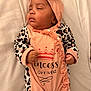 Ashanti participe au concours pour gagner de l'argent avec cette photo : baby, blanket, child, clothing, cute, fabric, face, hand, headband, indoor, infant, leopard_print, newborn, onesie, peaceful, pink, portrait, resting, sleeping, soft