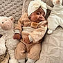 Ashanti participe au concours pour gagner de l'argent avec cette photo : baby, sleeping, infant, stuffed_animal, plush_toy, blanket, cozy, headband, cute, soft, child, toddler, resting, couch, home, warm, knitwear, socks, relaxation, peaceful