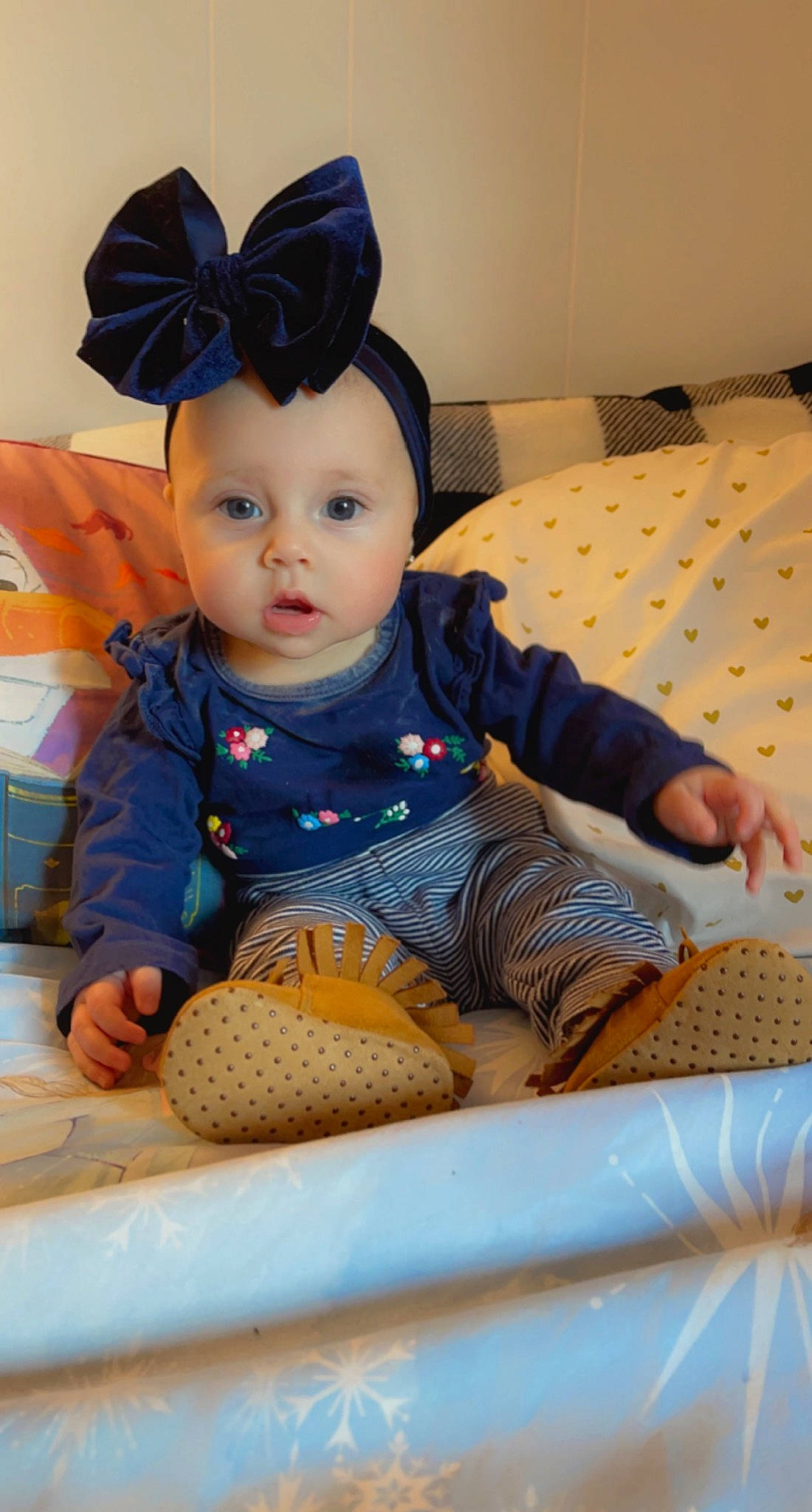 Veronica is registered to the contest to win money with this photo: baby, baby_toddler_clothing, blue, child, comfort, doll, fun, fur, outerwear, pattern, person, product, room, sitting, skin, sleeve, surprise, textile, toddler, toy