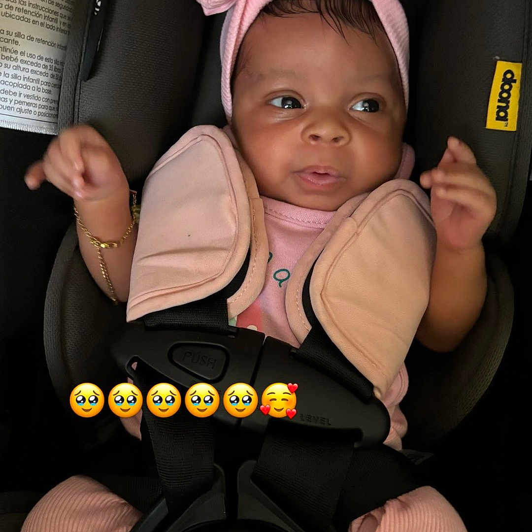 Northrenity joined the competition — help win amazing prizes! accessory, adorable, baby, bow, bracelet, car_seat, car_seat_strap, child, clothing, cute, expression, face, headband, indoors, infant, person, pink_clothing, safety_harness, seatbelt, young_child