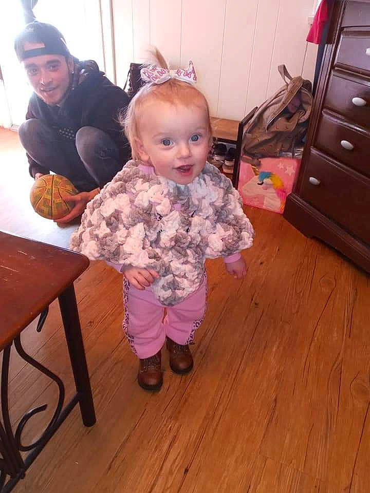 Aleeyah is registered to the contest to win money with this photo: cheek, child, floor, flooring, furniture, head, headwear, joy, person, pink, play, room, skin, standing, toddler, wood