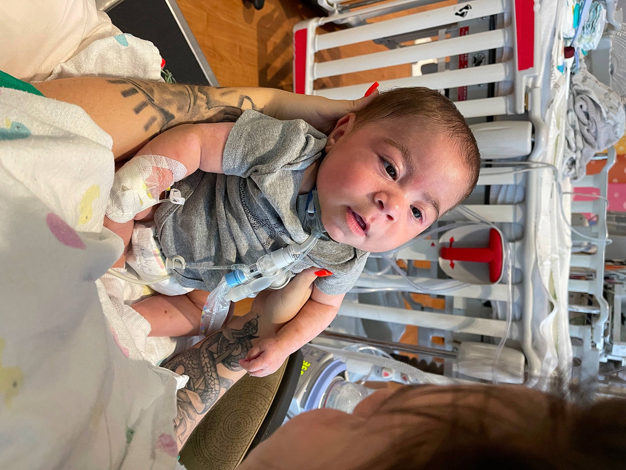 Kashton is registered to the contest to win money with this photo: baby, baby_products, baby_safety, baby_toddler_clothing, child, comfort, fun, happy, person, room, shelf, sitting, smile, toddler, wood