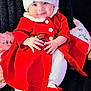 Joy is registered to the contest to win money with this photo: baby, infant, child, christmas, santa_hat, red_dress, smile, blue_eyes, sitting, blanket, pillow, holiday, festive, portrait, cute, hands, socks, bow, cozy, sparkle