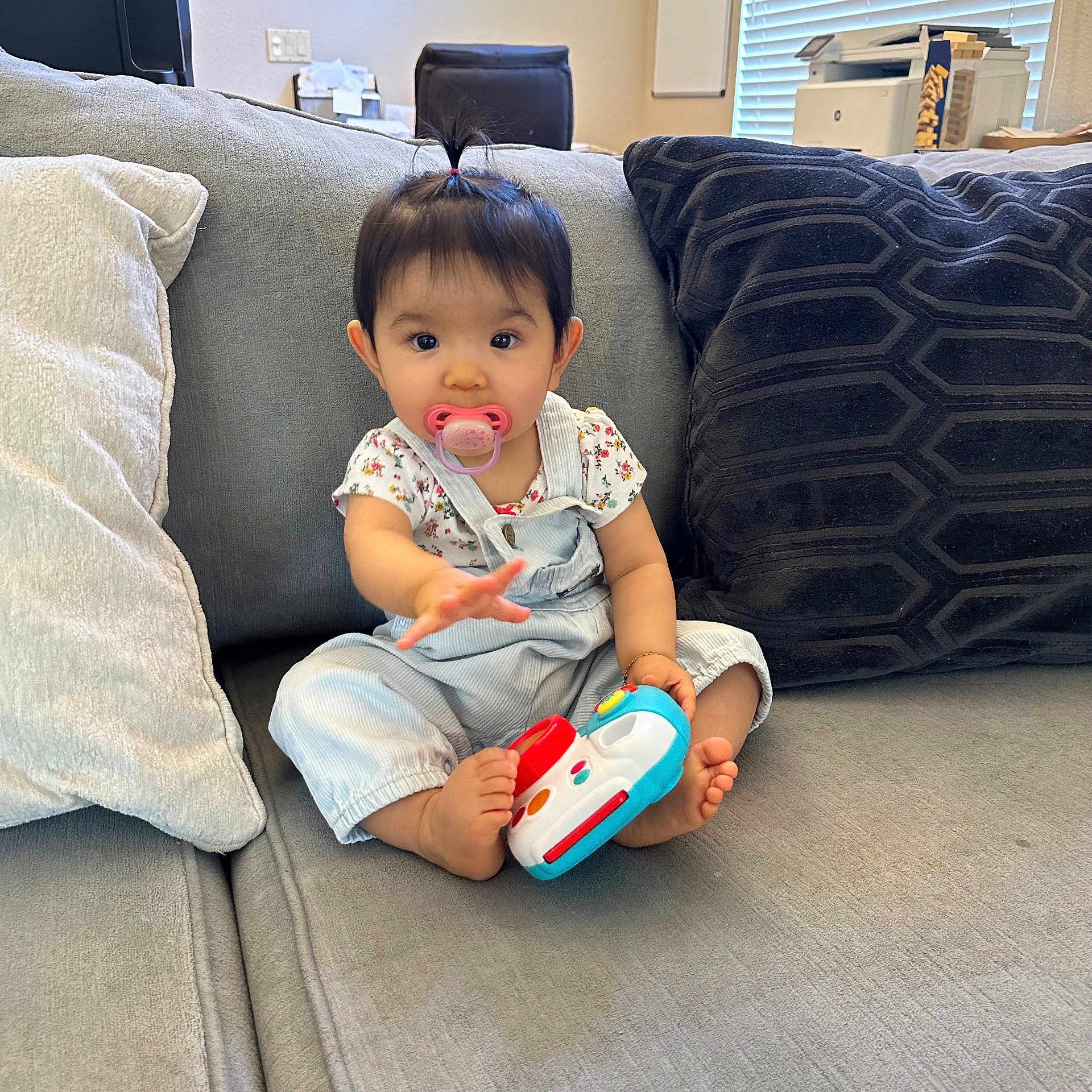 Emelyn is registered to the contest to win money with this photo: architecture, baby, building, clothing, couch, cushion, face, furniture, head, homedecor, indoors, interiordesign, livingroom, pants, person, photography, pillow, portrait, room, sitting