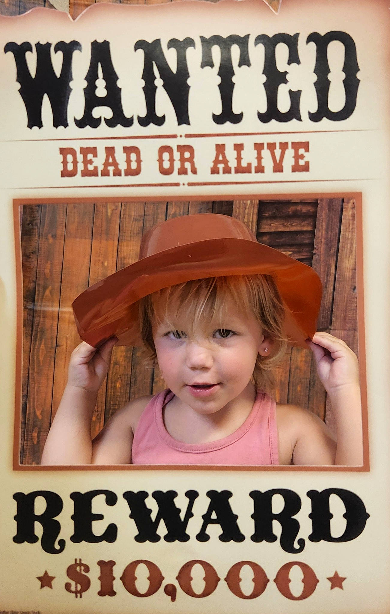 Dallas is registered to the contest to win money with this photo: advertising, art, book_cover, child, costume_hat, eyelash, fashion_accessory, fiction, font, happy, hat, illustration, magazine, person, photo_caption, poster, publication, room, smile, sun_hat