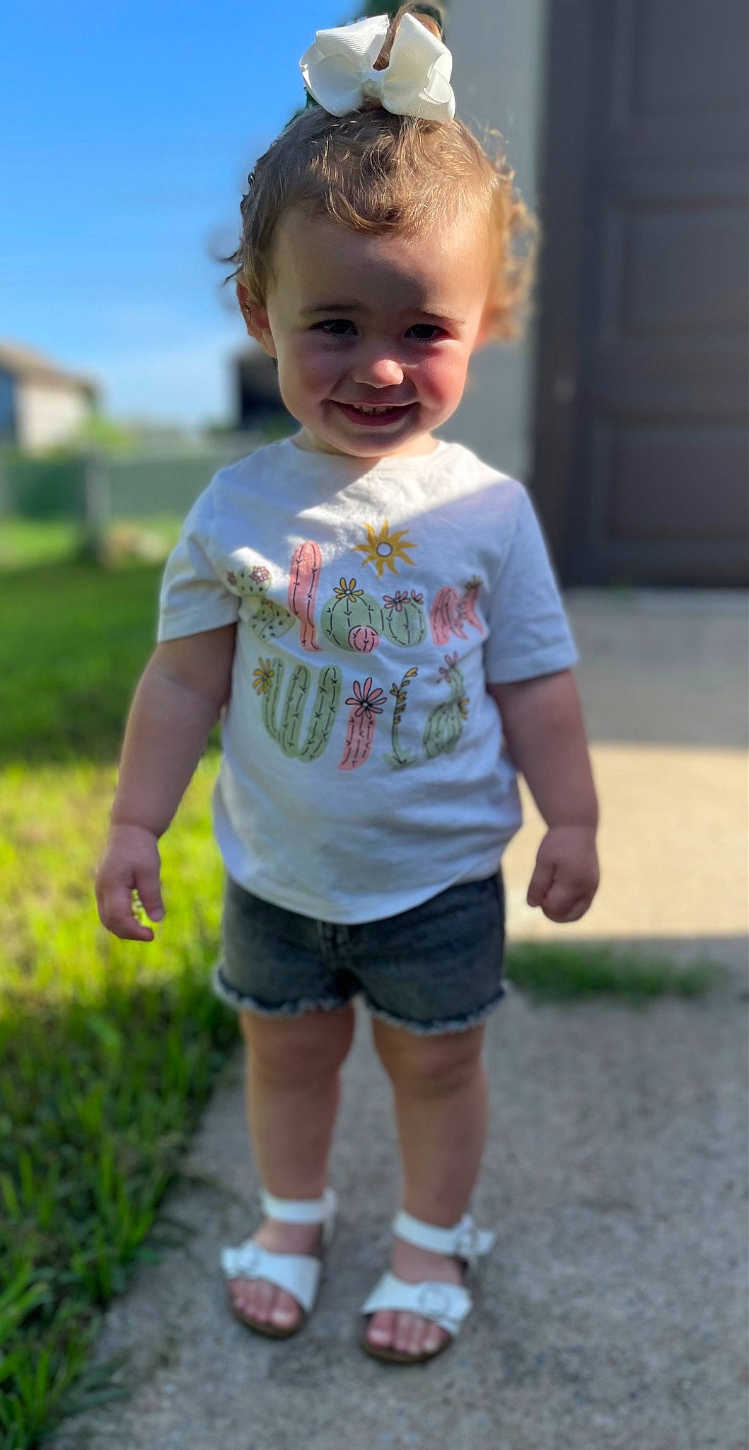 Sage joined the competition — help win amazing prizes! asphalt, baby_toddler_clothing, chin, face, facial_expression, fun, grass, hair, happy, head, joy, leisure, person, plant, shorts, sky, sleeve, smile, standing, summer