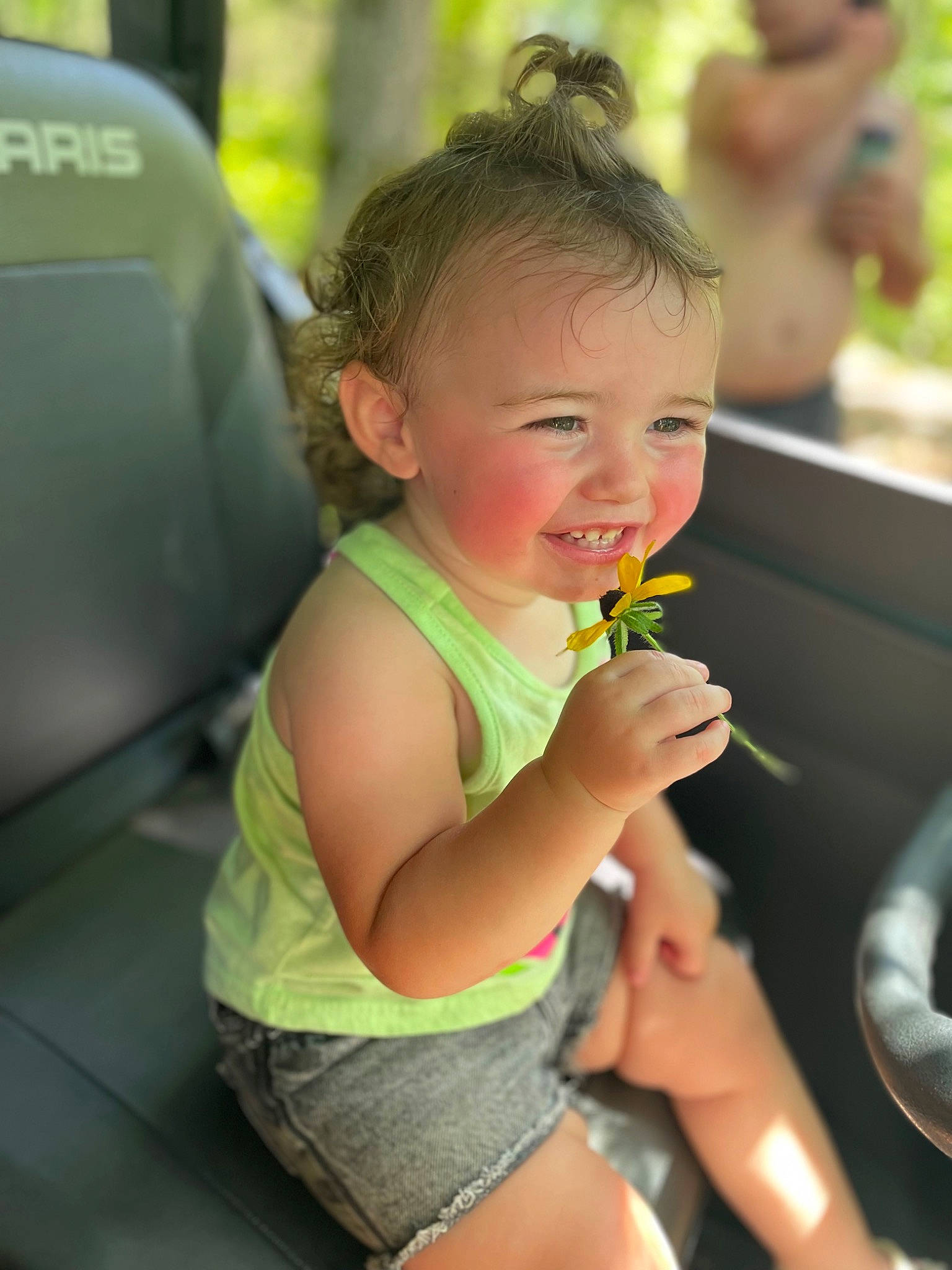 Sage is registered to the contest to win money with this photo: auto_part, baby, child, face, family_car, fun, grass, hair, happy, head, human_leg, joy, leaf, leisure, person, recreation, skin, smile, thigh, thumb