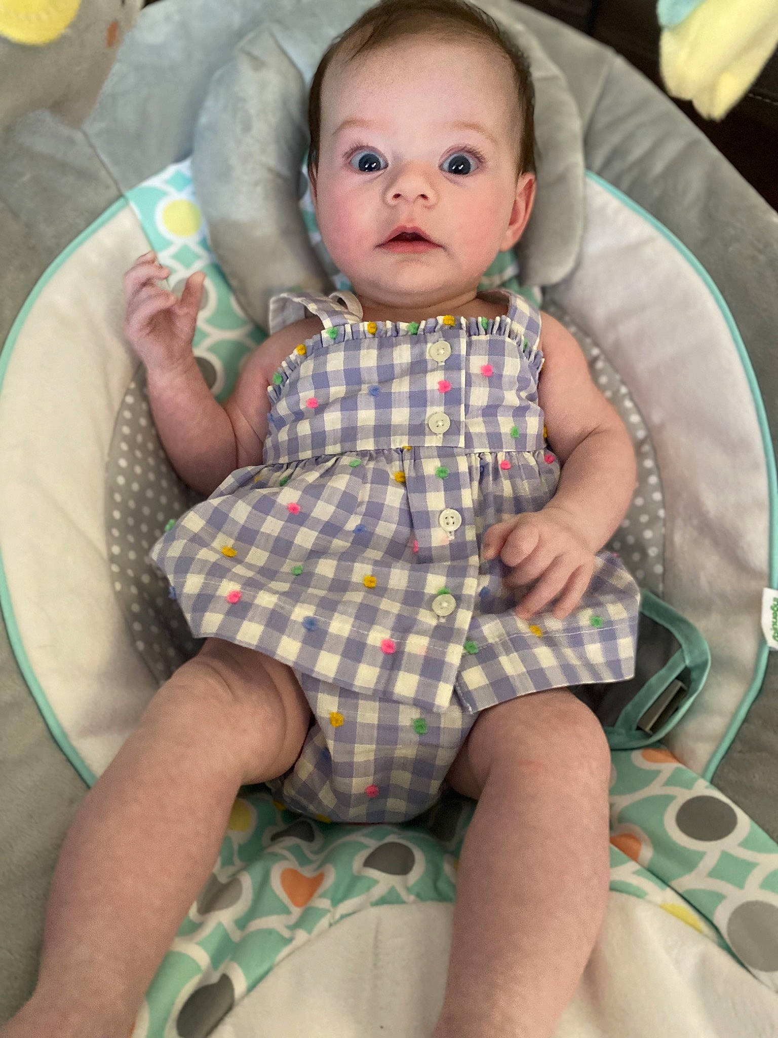 Eloise is registered to the contest to win money with this photo: baby, baby_toddler_clothing, chair, cheek, child, comfort, eye, face, finger, head, lap, linens, mouth, pattern, person, plaid, skin, sleeve, thigh, toddler