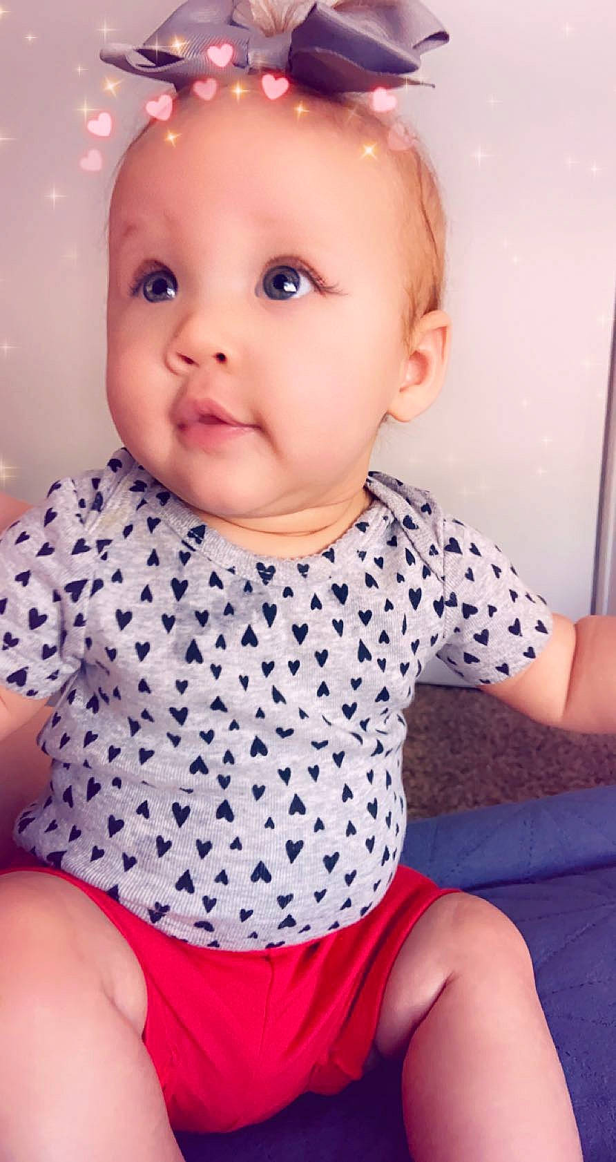 Amilia is registered to the contest to win money with this photo: baby, baby_products, baby_toddler_clothing, cheek, child, child_model, design, face, head, lip, pattern, person, pink, polka_dot, product, sitting, skin, sleeve, smile, toddler