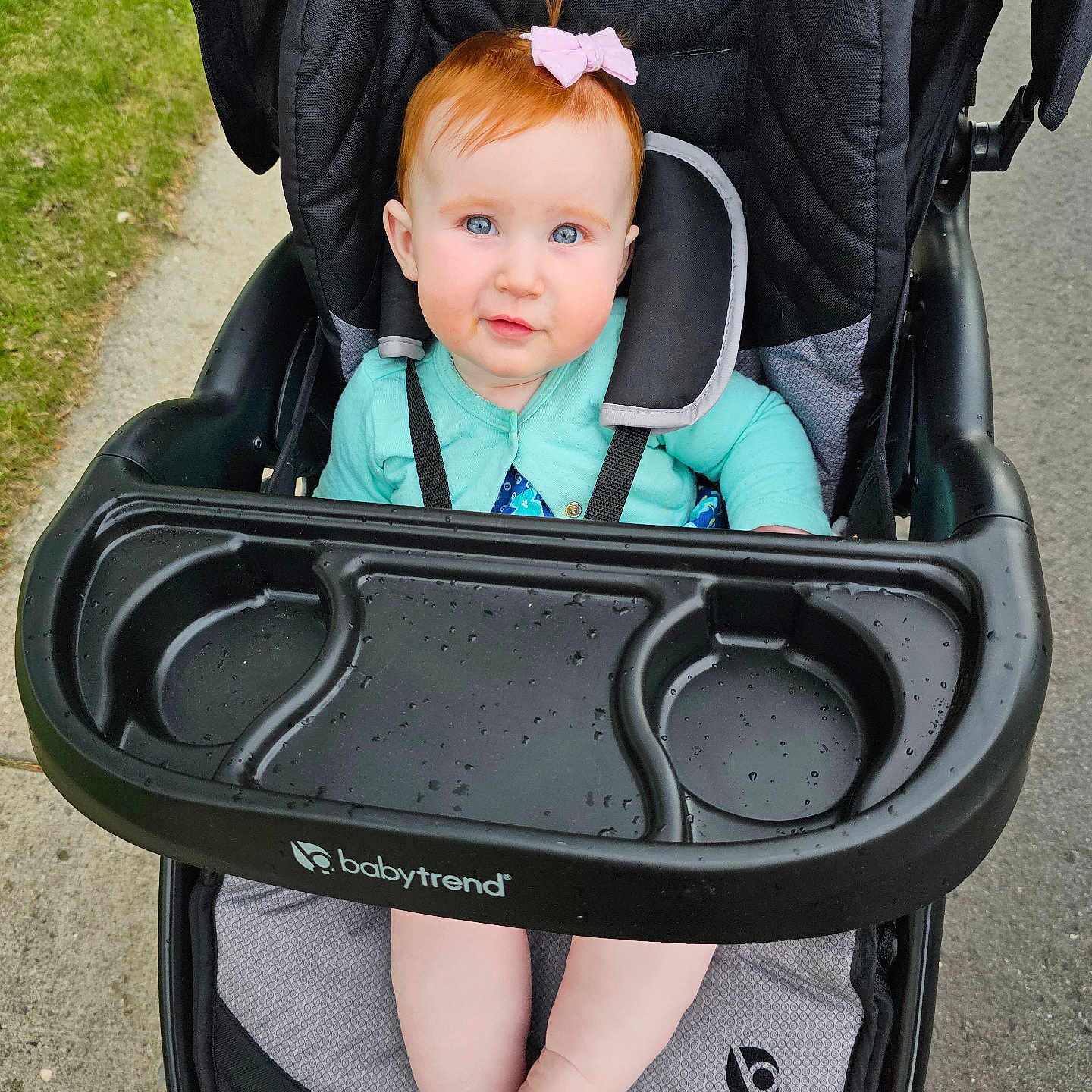 Rylee is registered to the contest to win money with this photo: accessories, baby, city, clothing, face, grass, head, nature, outdoors, park, person, photography, plant, portrait, road, strap, street, stroller, sunglasses, urban