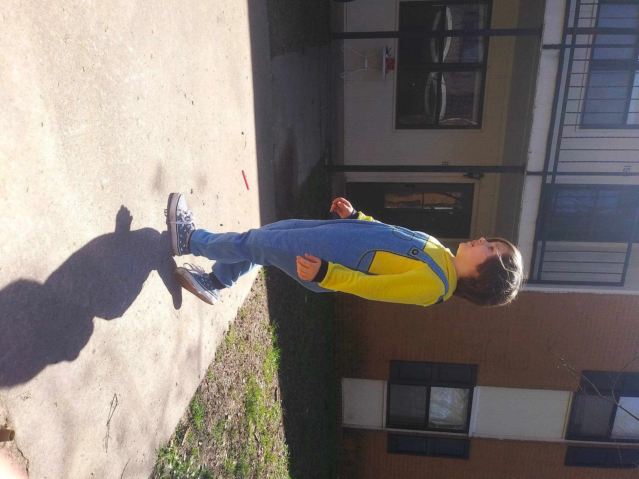 David joined the competition — help win amazing prizes! building, composite_material, concrete, door, electric_blue, facade, fixture, fun, person, shadow, t_shirt, walking_shoe, window, wrist