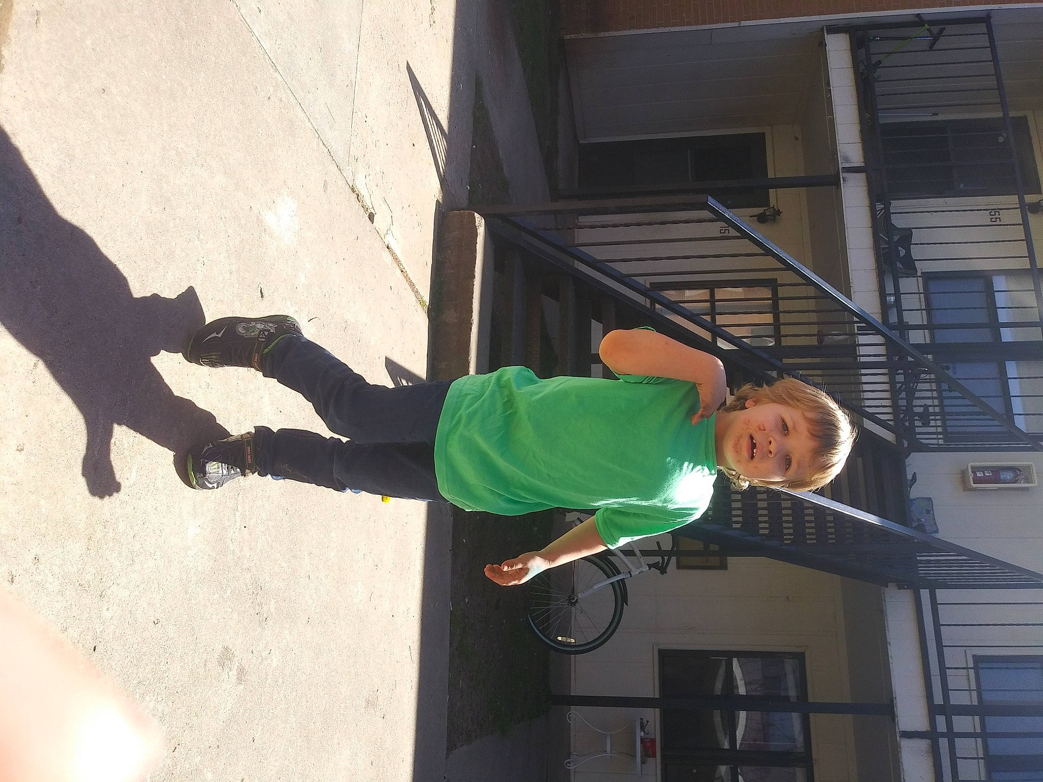 Kyler is registered to the contest to win money with this photo: elbow, facade, fun, human_leg, knee, leisure, outdoor_shoe, pedestrian, person, recreation, road, road_surface, shadow, sidewalk, street, street_fashion, walking_shoe, window