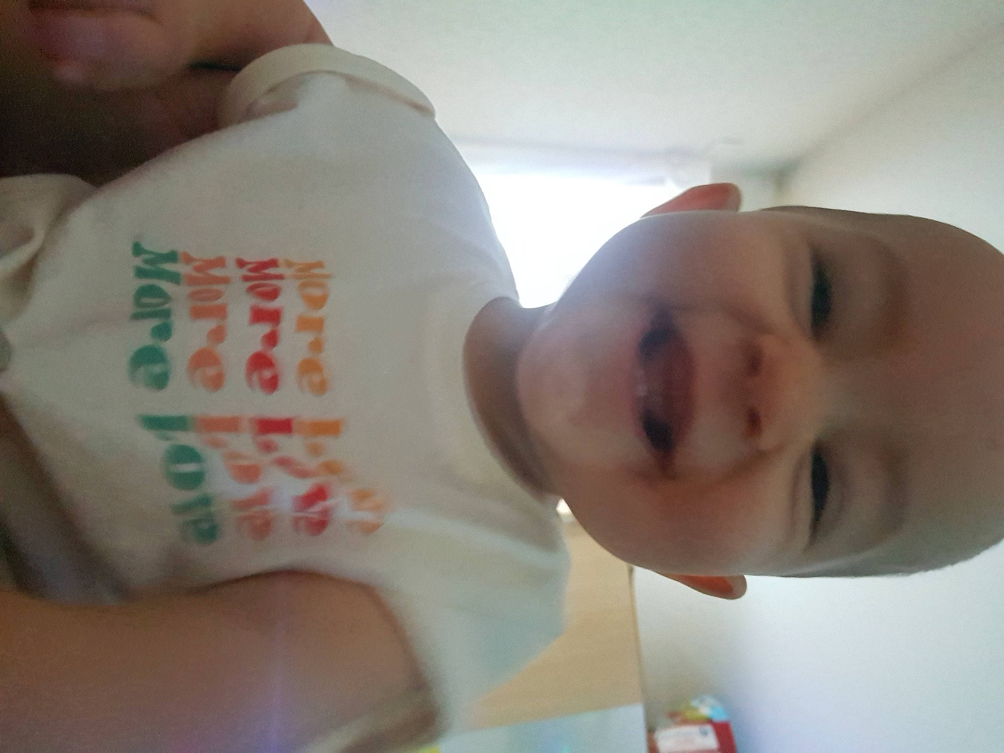 Elena participe au concours pour gagner de l'argent avec cette photo : baby, baby_laughing, baby_products, baby_toddler_clothing, bottle, cheek, child, finger, happy, nail, nose, person, skin, sleeve, smile, thumb, toddler