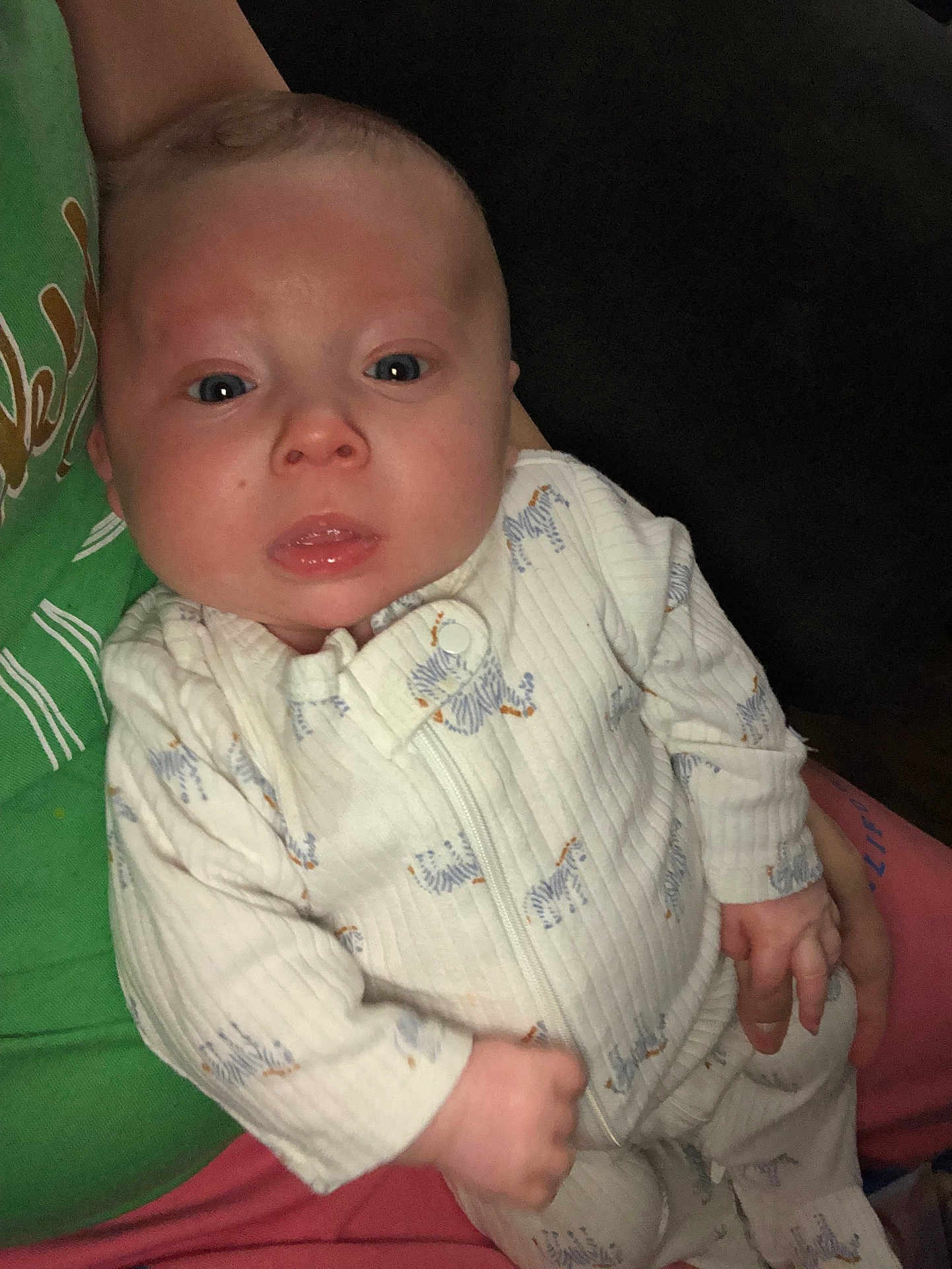 Andrew joined the competition — help win amazing prizes! baby, infant, onesie, zebra_print, clothing, person, face, hand, green_shirt, pink_pants, holding, portrait, indoor, cute, young_child, expression, human, skin, eyes, newborn