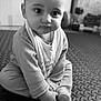 Azaan joined the competition — help win amazing prizes! baby, child, infant, sitting, hands, foot, mat, indoors, black_and_white, curious, wide_eyes, clothing, cute, portrait, floor, texture, young, person, monochrome, expression