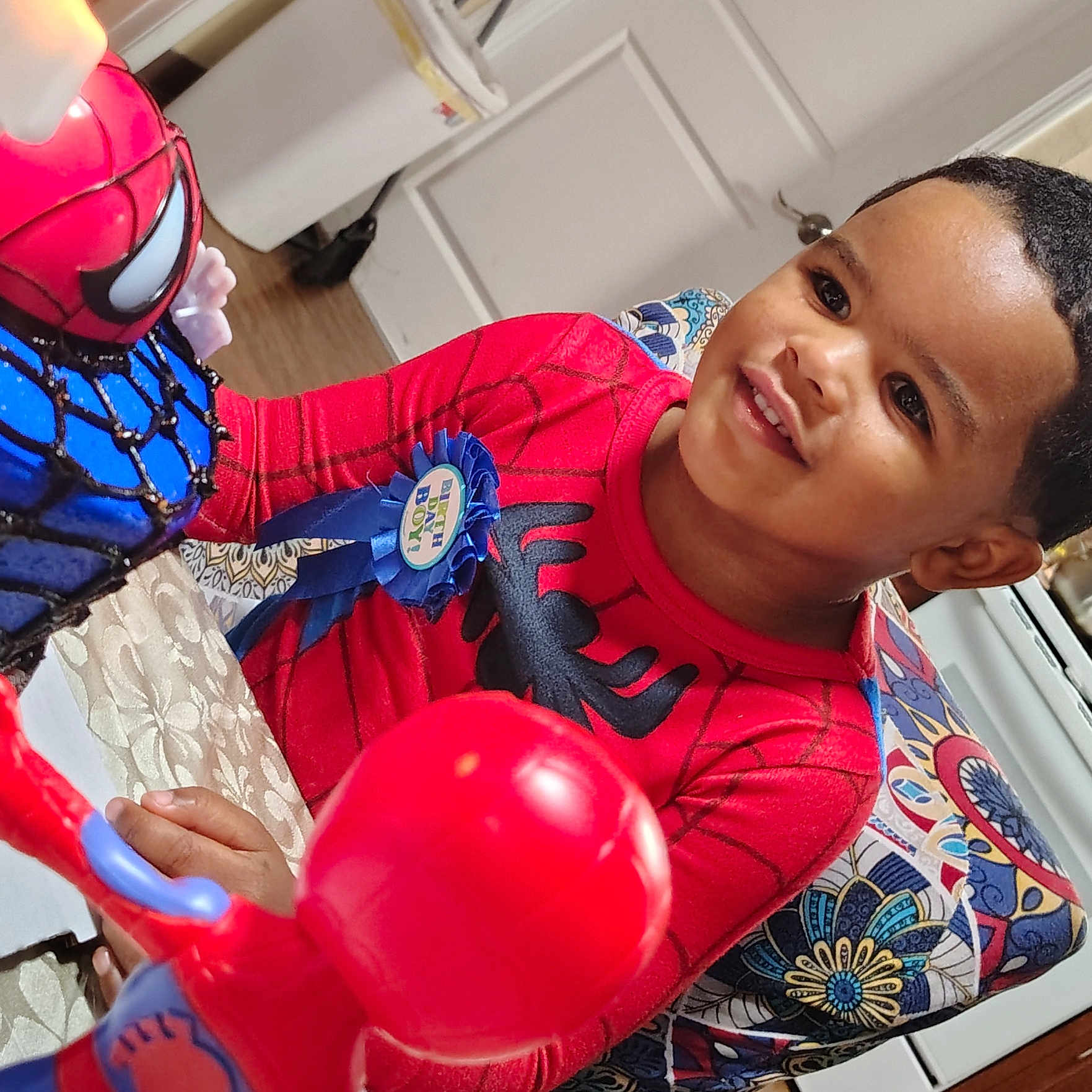 Tommy joined the competition — help win amazing prizes! birthday, boy, celebration, chair, child, costume, face, furniture, happy, head, indoor, kitchen, patterned_chair, person, play, ribbon, smile, spiderman, table, toy