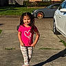 Brianna is registered to the contest to win money with this photo: casual_clothing, child, concrete, driveway, girl, grass, heart_graphic, house, lawn, leggings, parked_car, pigtails, pink_shirt, portrait, residential, shadow, slippers, smile, sunlight, wheel