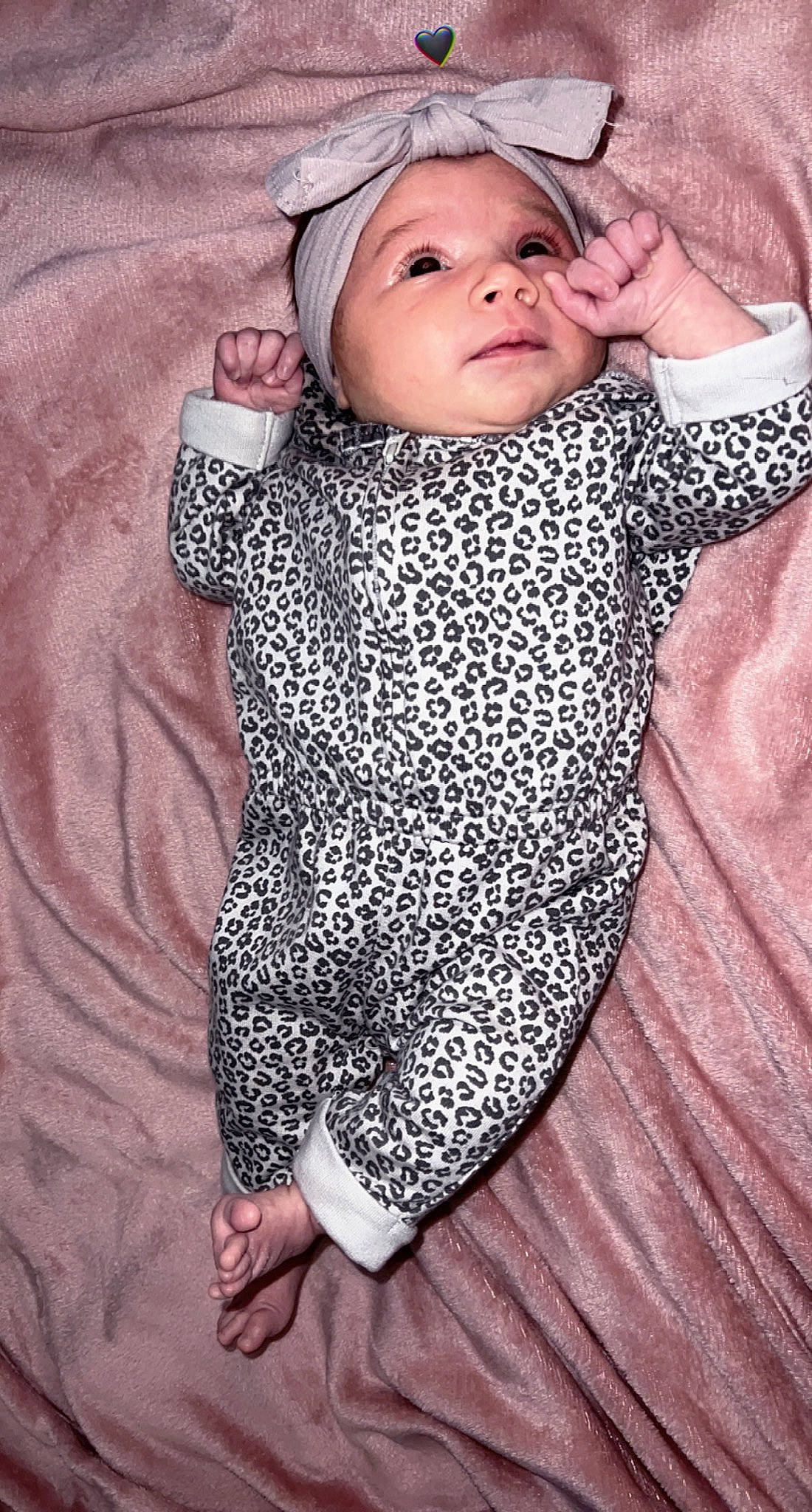 Aleah joined the competition — help win amazing prizes! baby, baby_toddler_clothing, cap, child, comfort, fashion_accessory, finger, gesture, happy, headwear, knit_cap, linens, lip, pattern, person, pink, skin, sleeve, textile, toddler