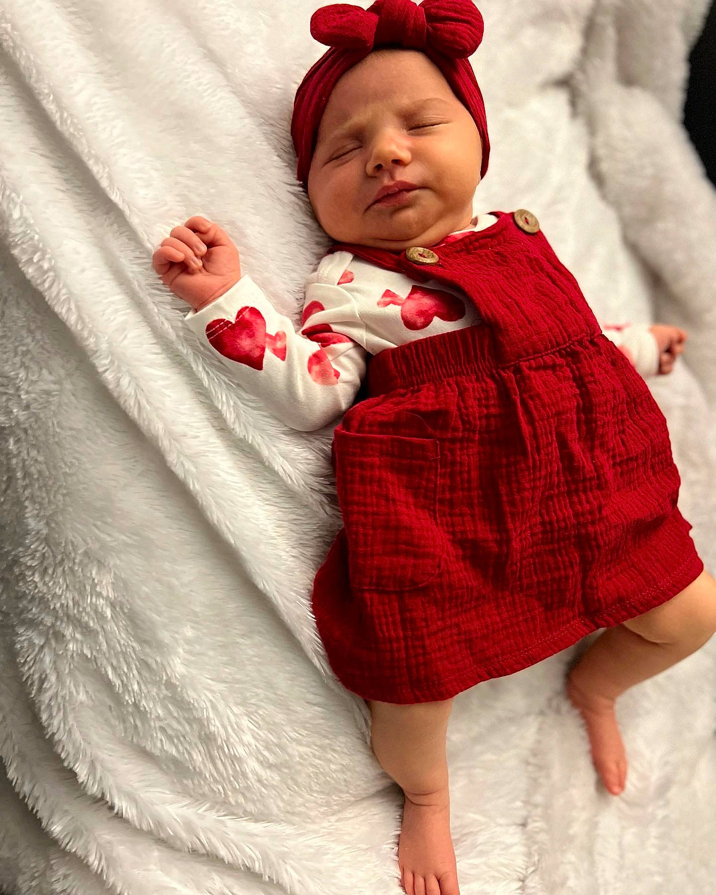 Aleah is registered to the contest to win money with this photo: baby, baby_toddler_clothing, cap, child, collar, day_dress, dress, face, hat, headgear, headwear, lip, one_piece_garment, outerwear, pattern, person, pink, red, skin, sleeve