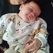 Kellya participe au concours pour gagner de l'argent avec cette photo : baby, sleeping, infant, clothing, hand, person, cute, peaceful, closeup, portrait, child, soft, fabric, cartoon, floral, comfort, rest, warm, indoors, holding