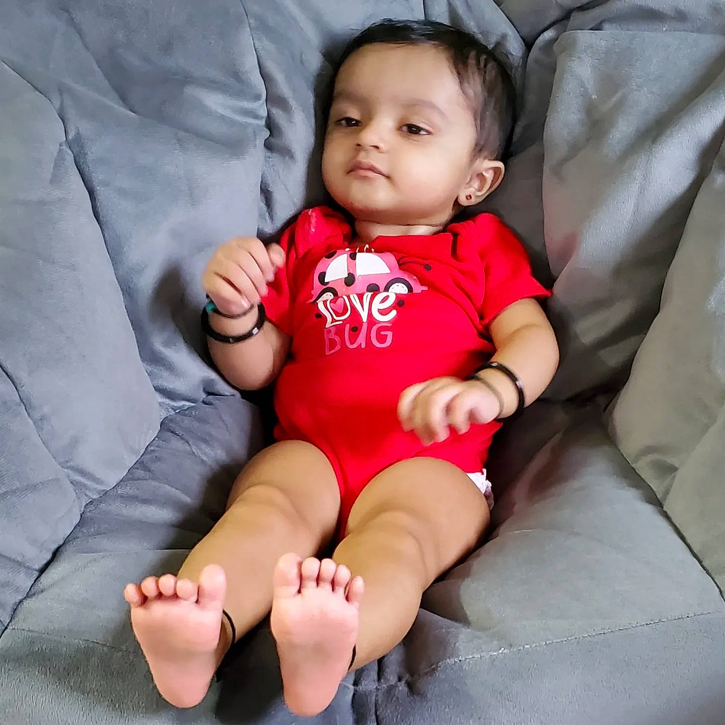 Shakti is registered to the contest to win money with this photo: baby_toddler_clothing, cheek, comfort, eye, face, finger, flash_photography, hand, head, joint, knee, leg, lip, neck, person, pink, skin, sleeve, stomach, thigh