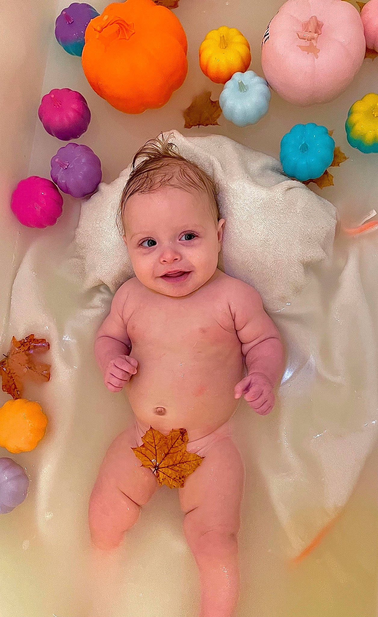 Lennyx is registered to the contest to win money with this photo: baby, baby_playing_with_toys, baby_products, baby_toddler_clothing, cheek, child, event, fun, happy, joy, orange, person, pink, play, product, skin, smile, stomach, thigh, thumb