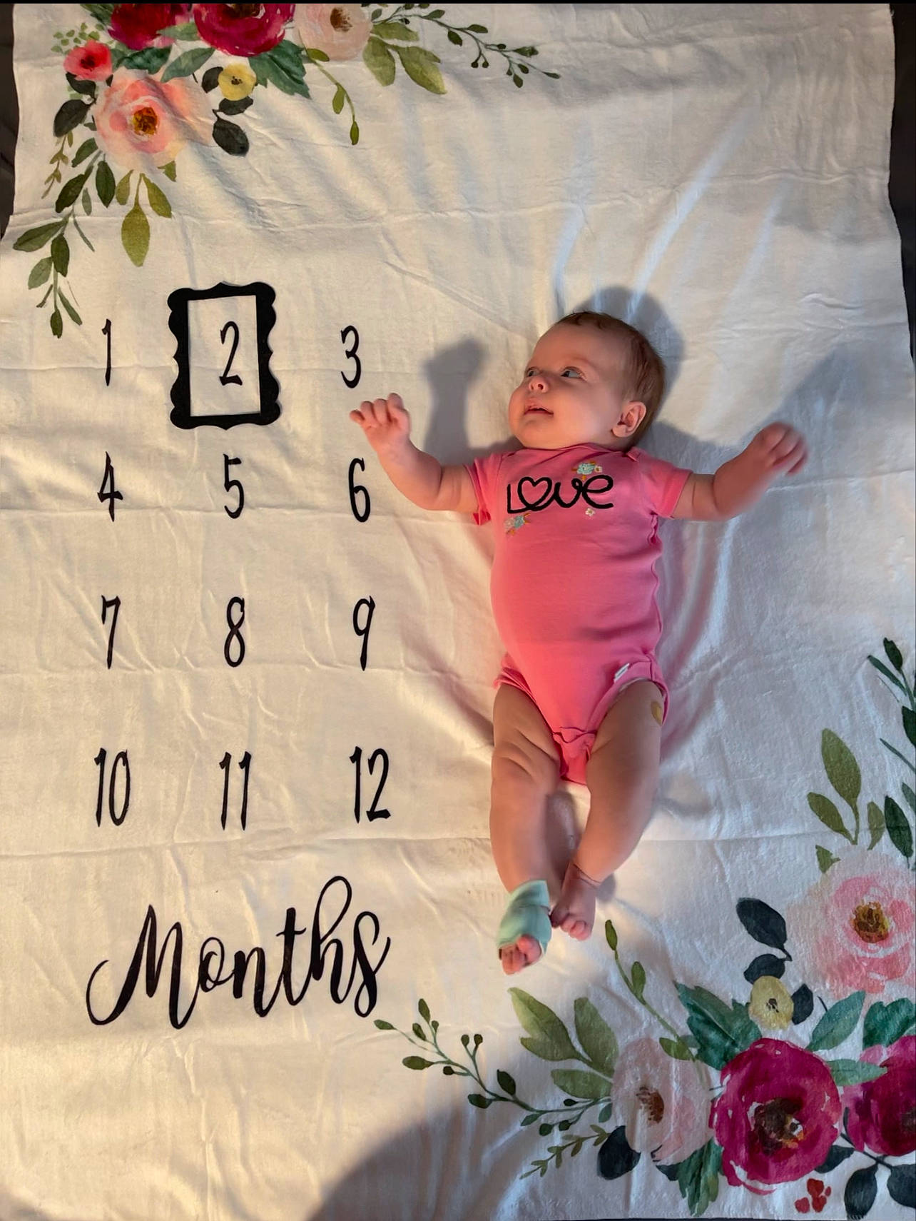 Lennyx is registered to the contest to win money with this photo: baby, baby_toddler_clothing, beauty, calendar, child, event, flower, font, happy, linens, magenta, pattern, person, petal, pink, plant, product, room, sleeve, textile