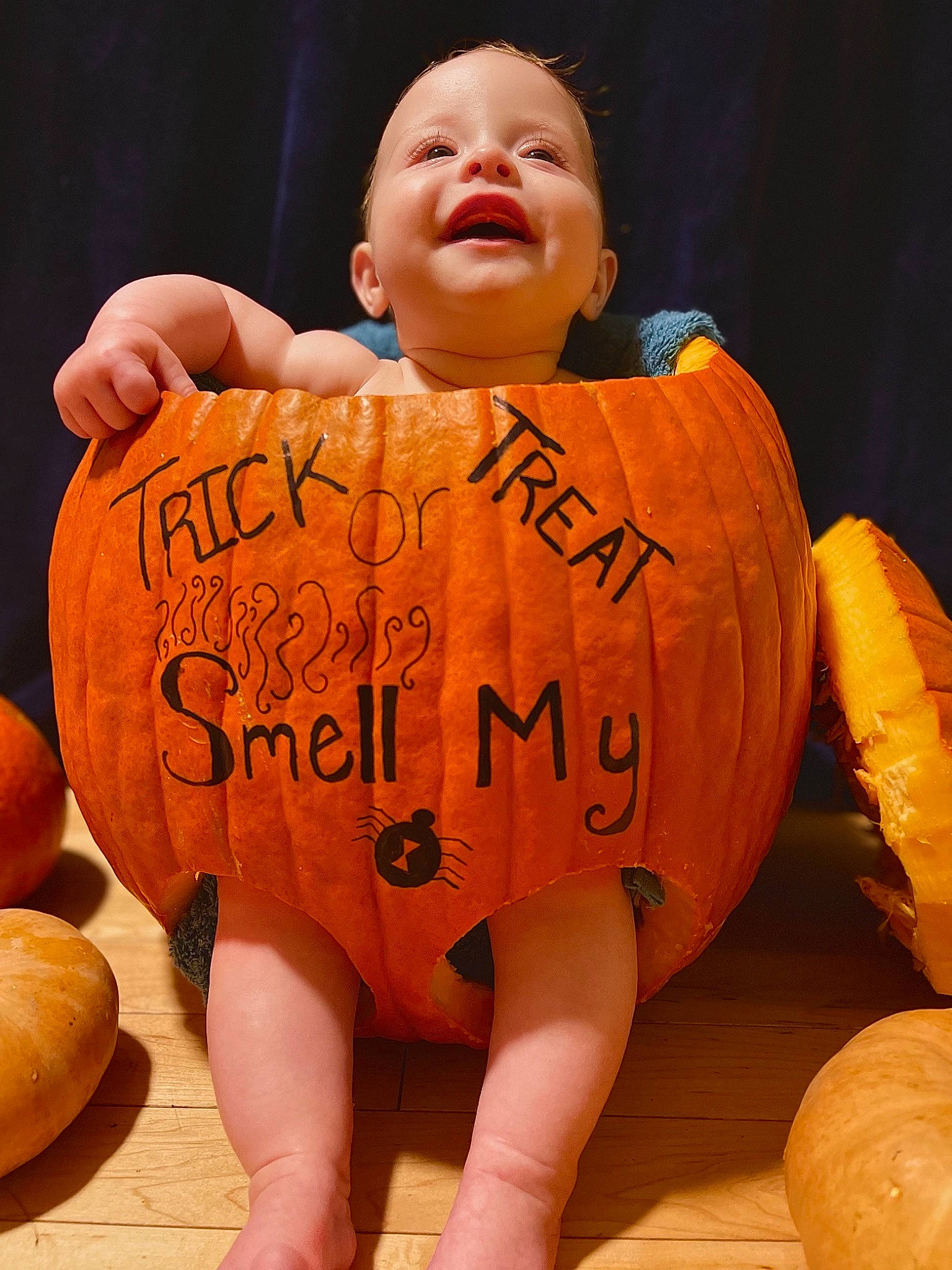 Lennyx joined the competition — help win amazing prizes! baby_toddler_clothing, calabaza, facial_expression, finger, gesture, gourd, happy, head, human_body, mouth, nose, orange, organ, person, pumpkin, sleeve, smile, thigh, thumb, toddler