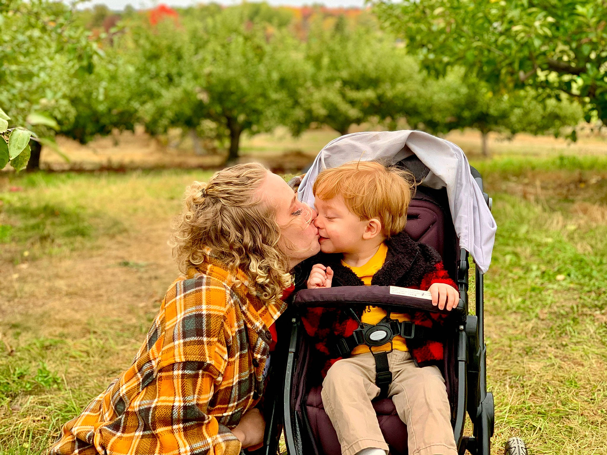 Grayson Kevin Anthony Sparks is registered to the contest to win money with this photo: fun, grass, grassland, green, happy, jacket, landscape, leisure, natural_landscape, people_in_nature, person, photograph, plaid, plant, recreation, sitting, spring, tartan, toddler, travel