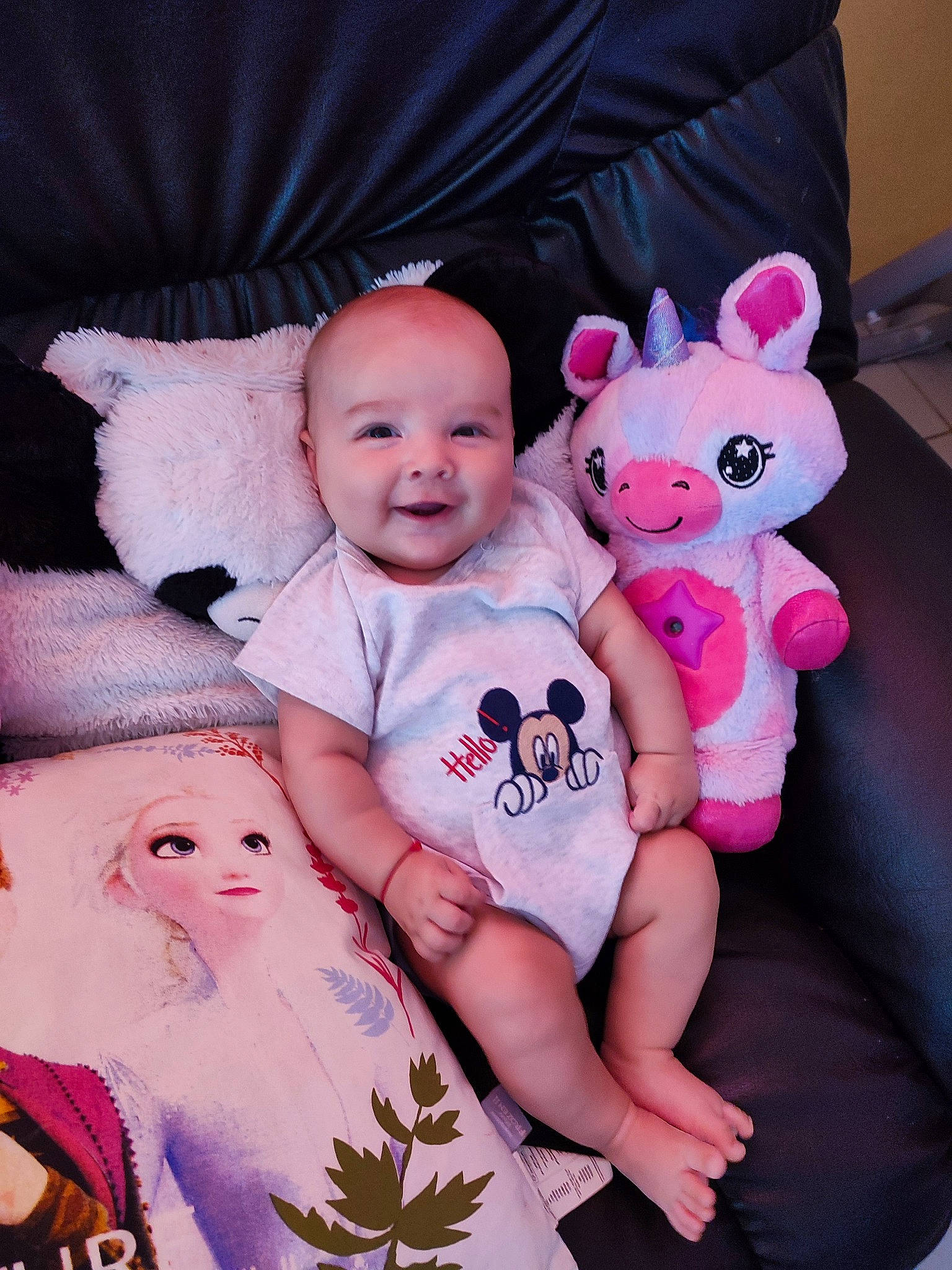 Patrick participe au concours pour gagner de l'argent avec cette photo : baby, baby_toddler_clothing, cheek, child, comfort, fun, happy, joy, magenta, mammal, person, pink, product, purple, skin, sleeve, smile, textile, toddler, toy