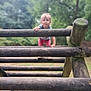 Julinne a rejoint le concours — aidez-le/la à gagner de superbes lots ! child, toddler, climbing, wood, jungle_gym, outdoor, playground, nature, greenery, trees, park, person, young_child, casual_clothing, curious, focused, daylight, fun, activity, adventure