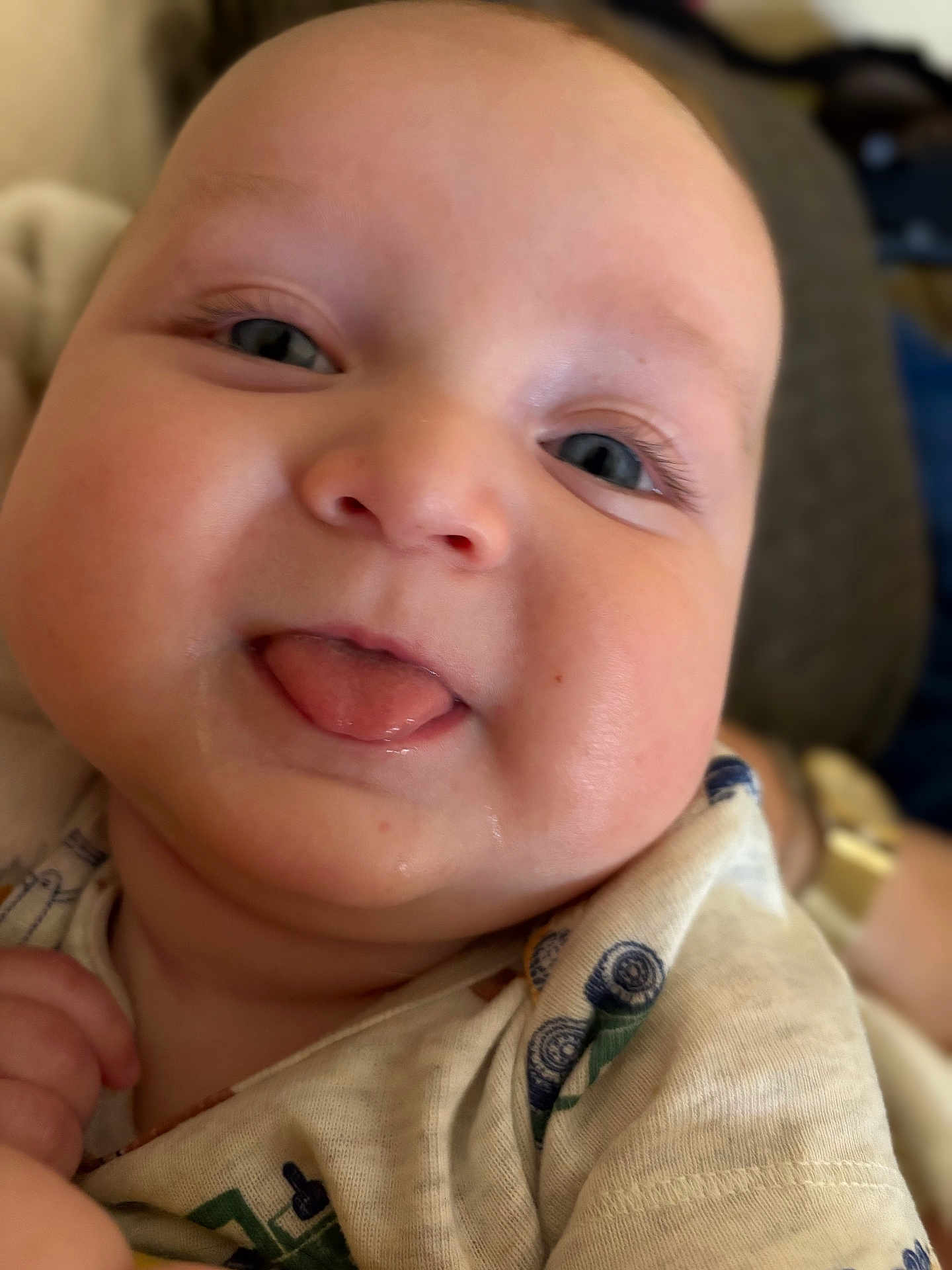 Wesson is registered to the contest to win money with this photo: baby, tongue, face, closeup, child, infant, cute, smiling, eyes, cheeks, clothing, person, skin, expression, playful, young, happy, portrait, indoors, head