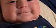 Wesson joined the competition — help win amazing prizes! baby, smiling, face, closeup, child, infant, tshirt, text, colorful, indoor, bed, blanket, person, happy, cute, portrait, video_call, screen, technology, young