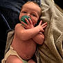 Wesson is registered to the contest to win money with this photo: baby, pacifier, diaper, blanket, infant, skin, hand, face, cute, lying_down, sleepwear, newborn, comfort, resting, child, soft, toddler, expression, person, indoors