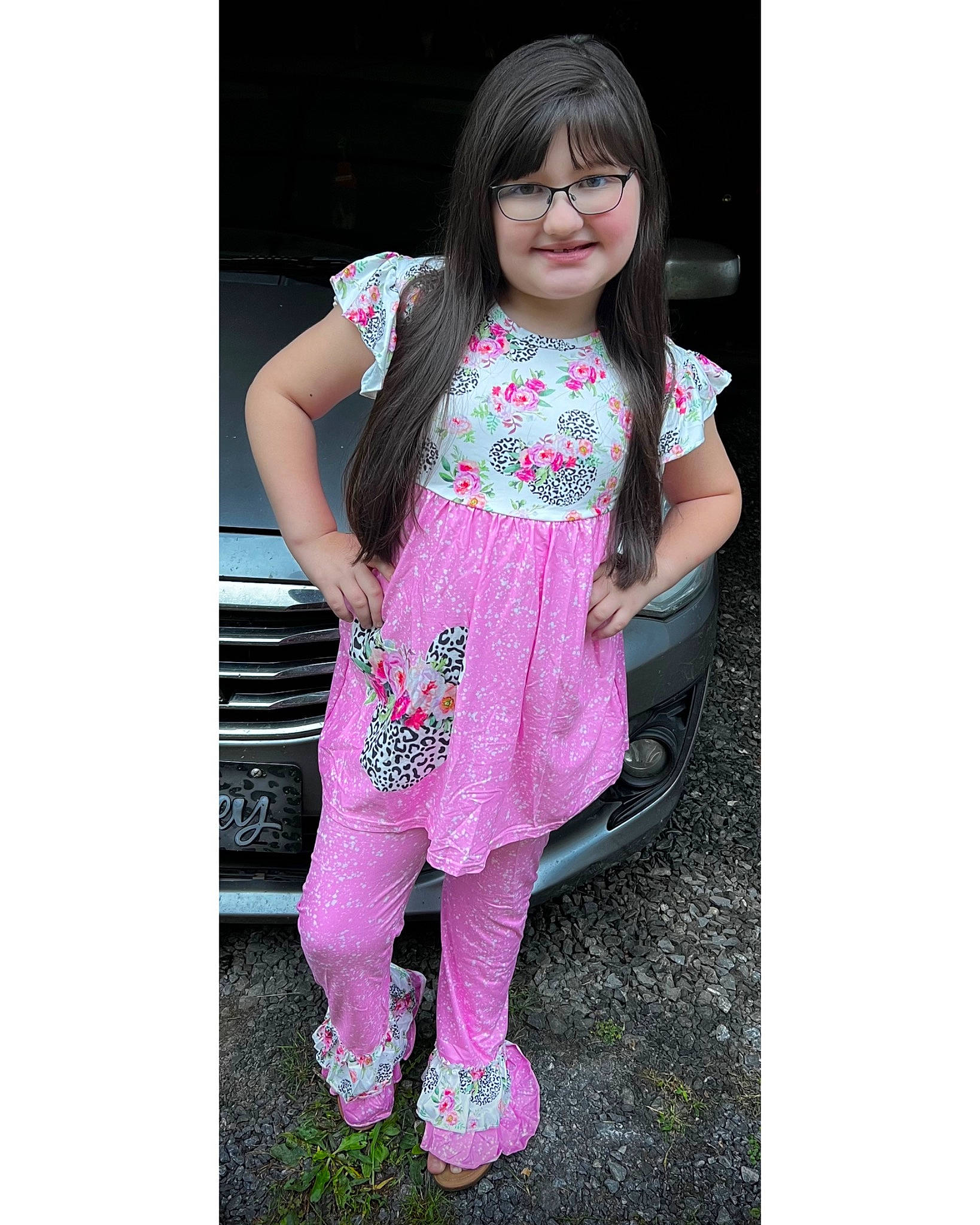Olivia is registered to the contest to win money with this photo: arm, baby_toddler_clothing, dress, eye, fashion_design, flower, footwear, hand, happy, human_body, jeans, joy, leg, magenta, pattern, person, pink, purple, sleeve, smile