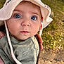 baby, child, face, hat, blue_eyes, curious, outdoor, person, portrait, clothing, hand, skin, cute, infant, looking, headwear, green_clothing, daylight, nature, closeup