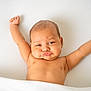 baby, infant, cute, pout, arms_stretched, lying_down, skin, expression, chubby, soft, white_background, child, portrait, adorable, relaxed, newborn, face, person, sleeping_area, blanket